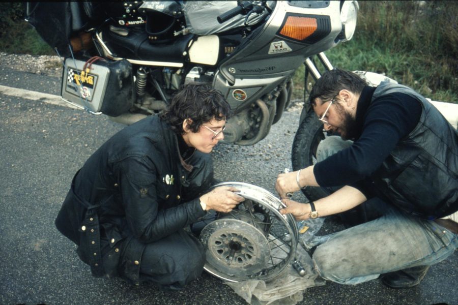 Re-spoking a motorcycle wheel at the side of the road is honest work. (Photo Mrs Bear)