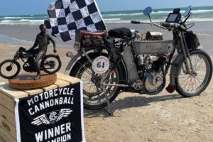 Currier's winning Harley and the very cool trophy he gets to show off.    Image courtesy of the Motorcycle Cannonball