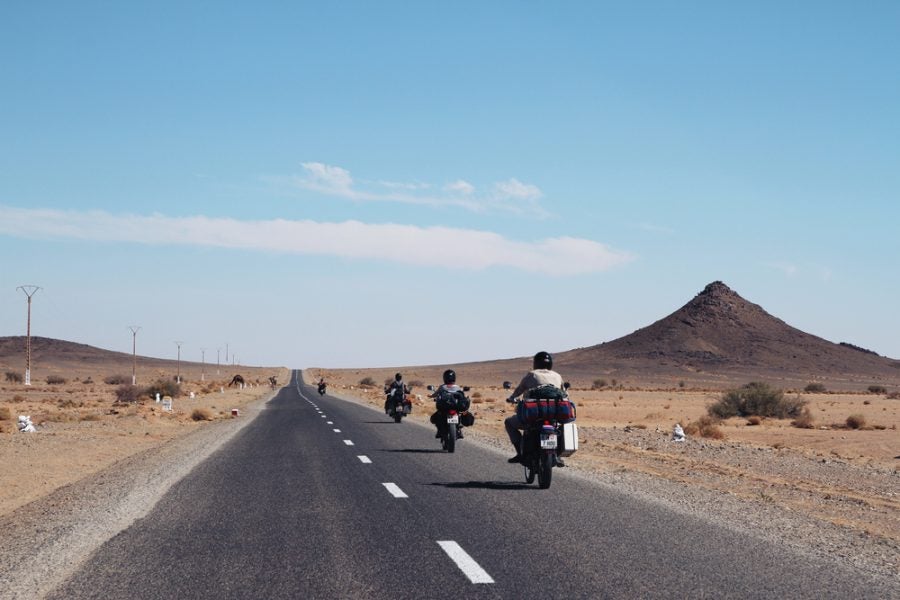 A group of riders travels a Moroccan highway. Is this just another thing to do, these days? Has the sheer adventure of riding in Africa been diluted by social media? Photo: JTHC/Shutterstock.com